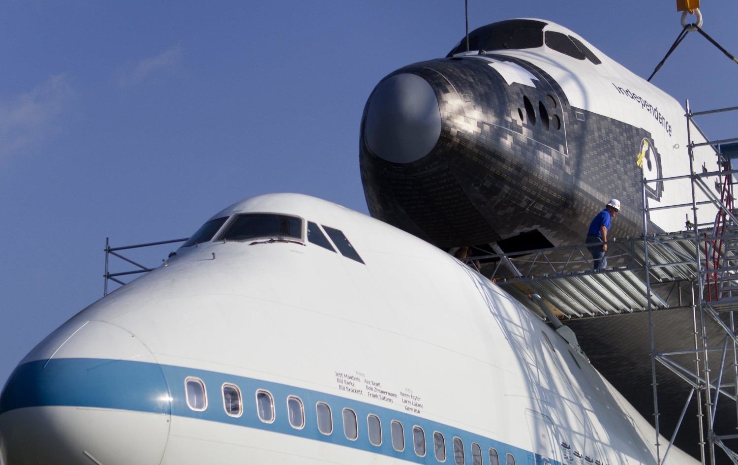 Rise of Independence: Mock Space Shuttle Hoisted Atop Historic