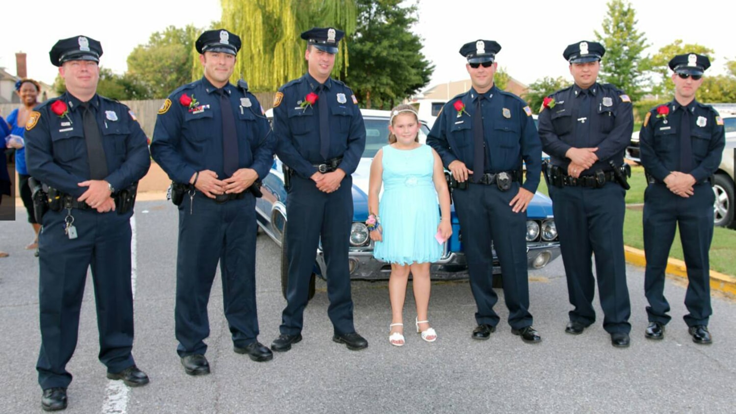 Policemen attend father-daughter dance with girl whose dad died in line of  duty