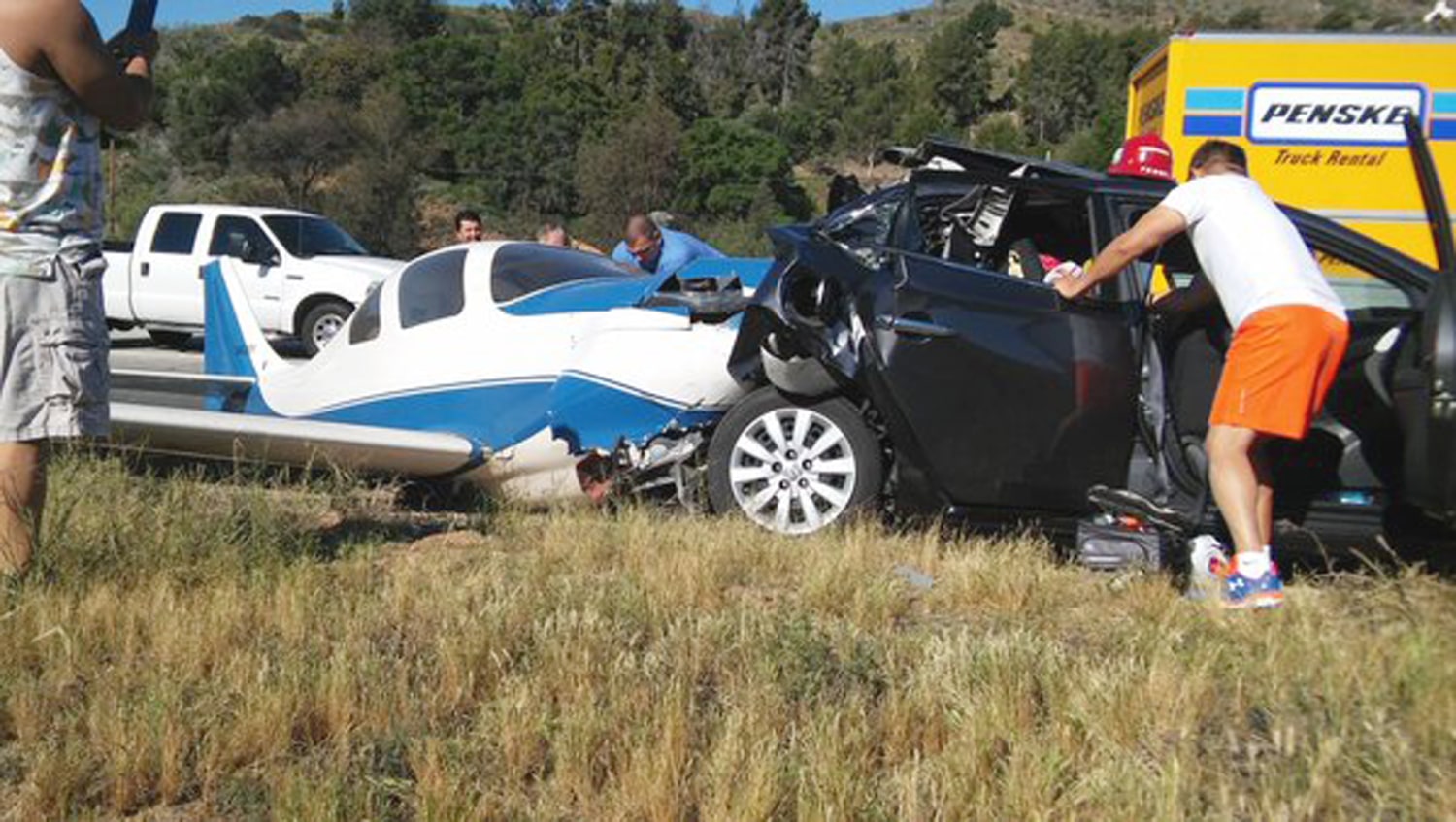 Small plane crashes into car during emergency landing in North