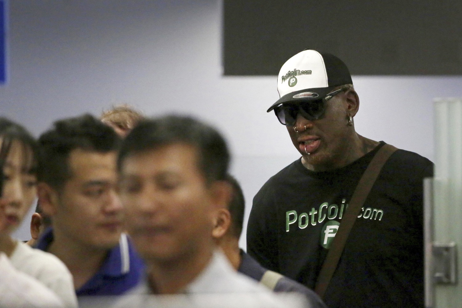 Rodman, ex-NBA players arrive in North Korea for basketball game