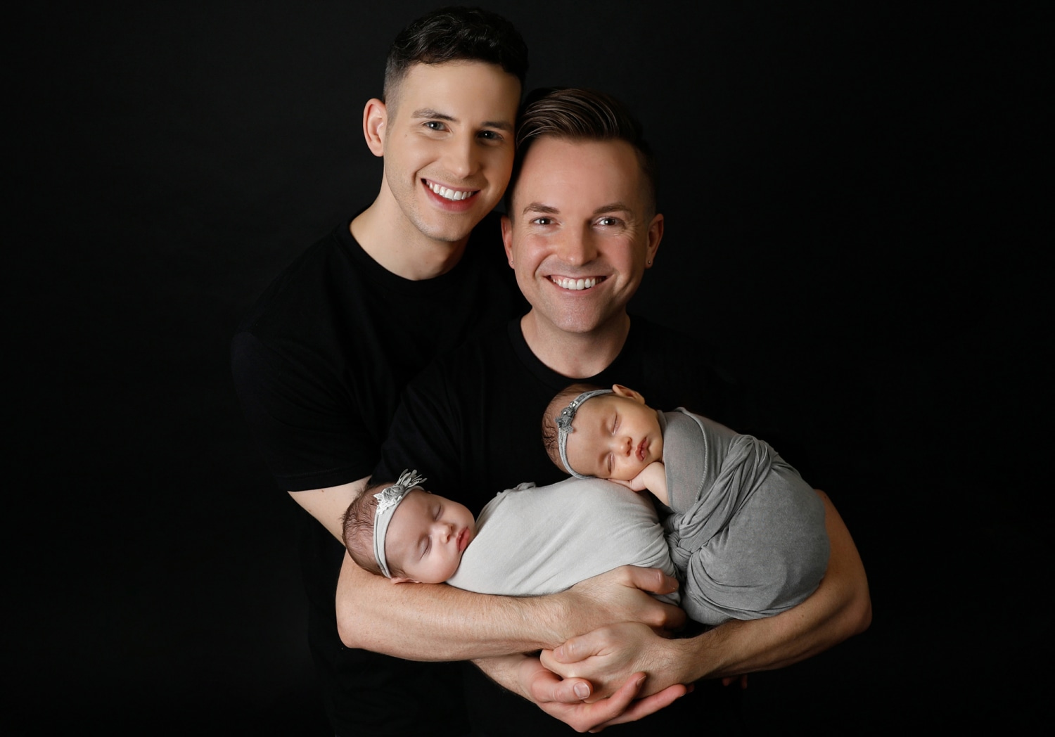 For gay parents, first comes the baby — then comes the debt image
