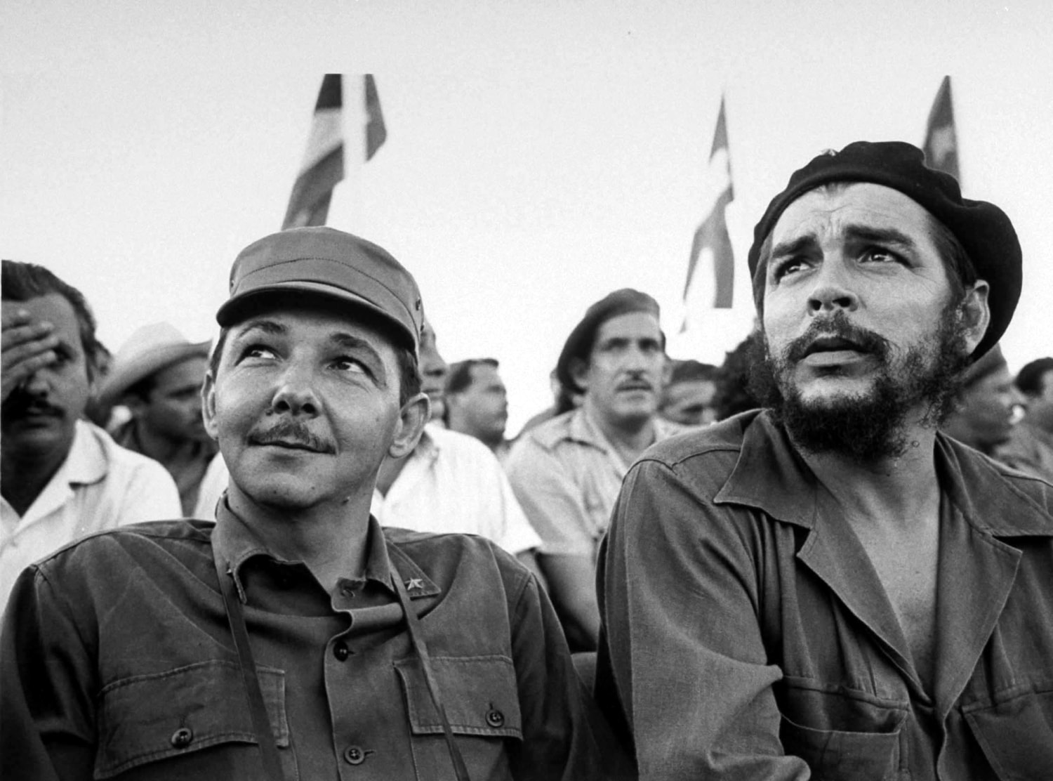 Che Guevara third from left and Fidel Castro far left marching to