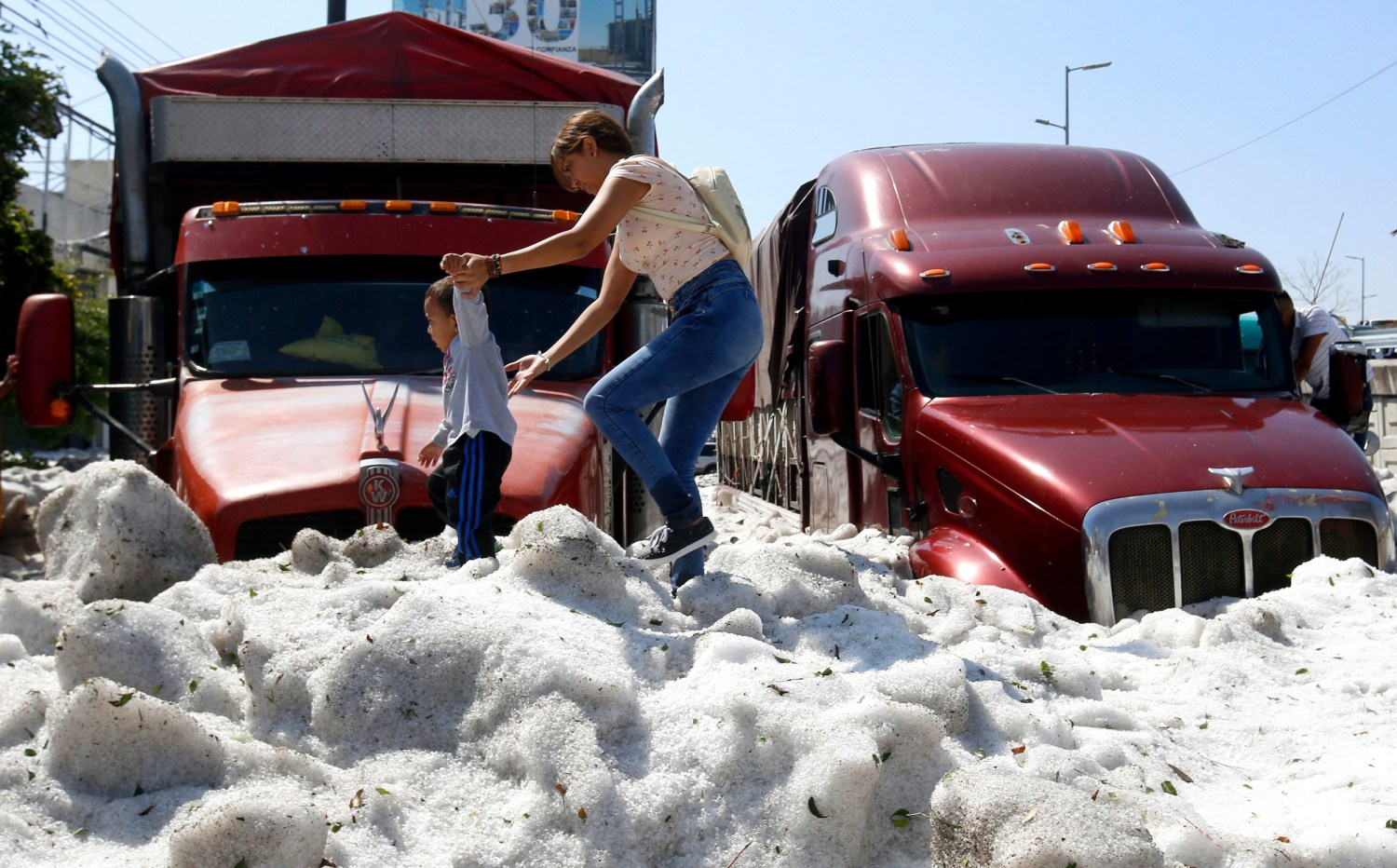 Summer hailstorm in Guadalajara Mexico buries cars damages houses