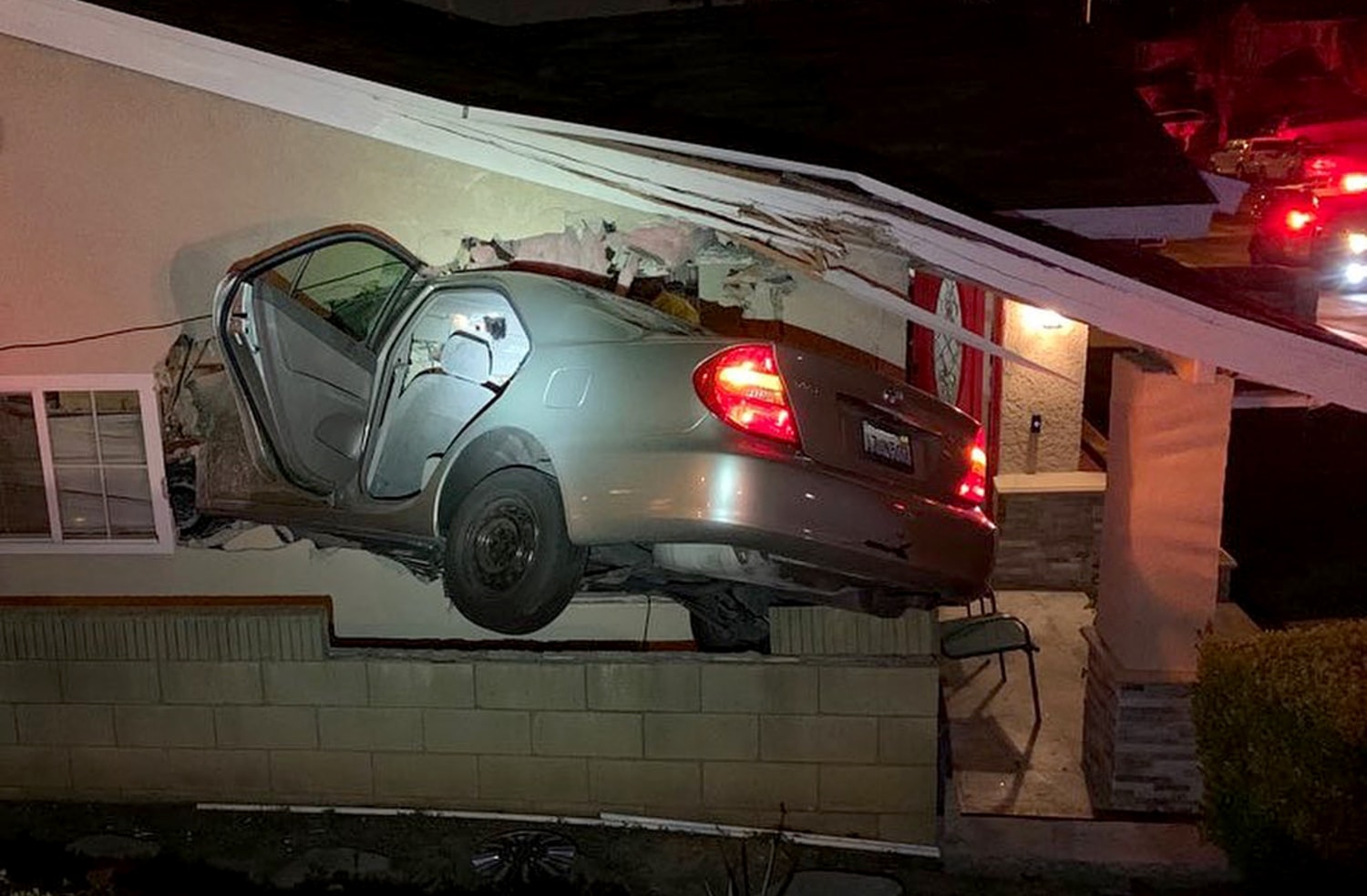 Car flies off freeway, destroys home