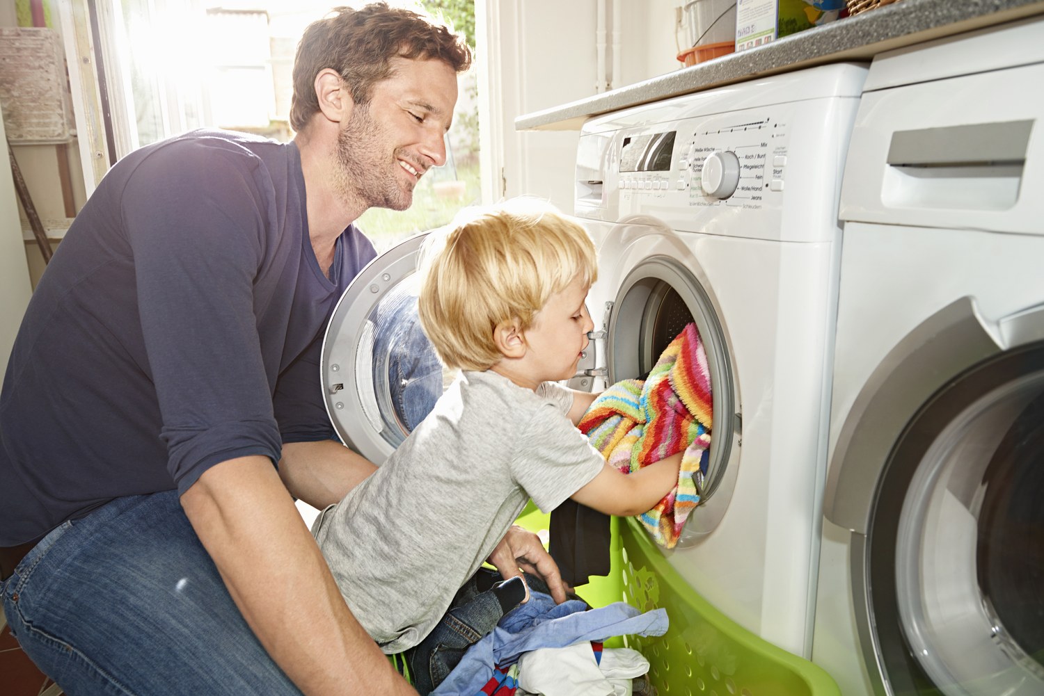 https://media-cldnry.s-nbcnews.com/image/upload/t_fit-1500w,f_auto,q_auto:best/newscms/2021_21/3348941/200513-stock-father-son-washer-dryer-ew-805p.jpg