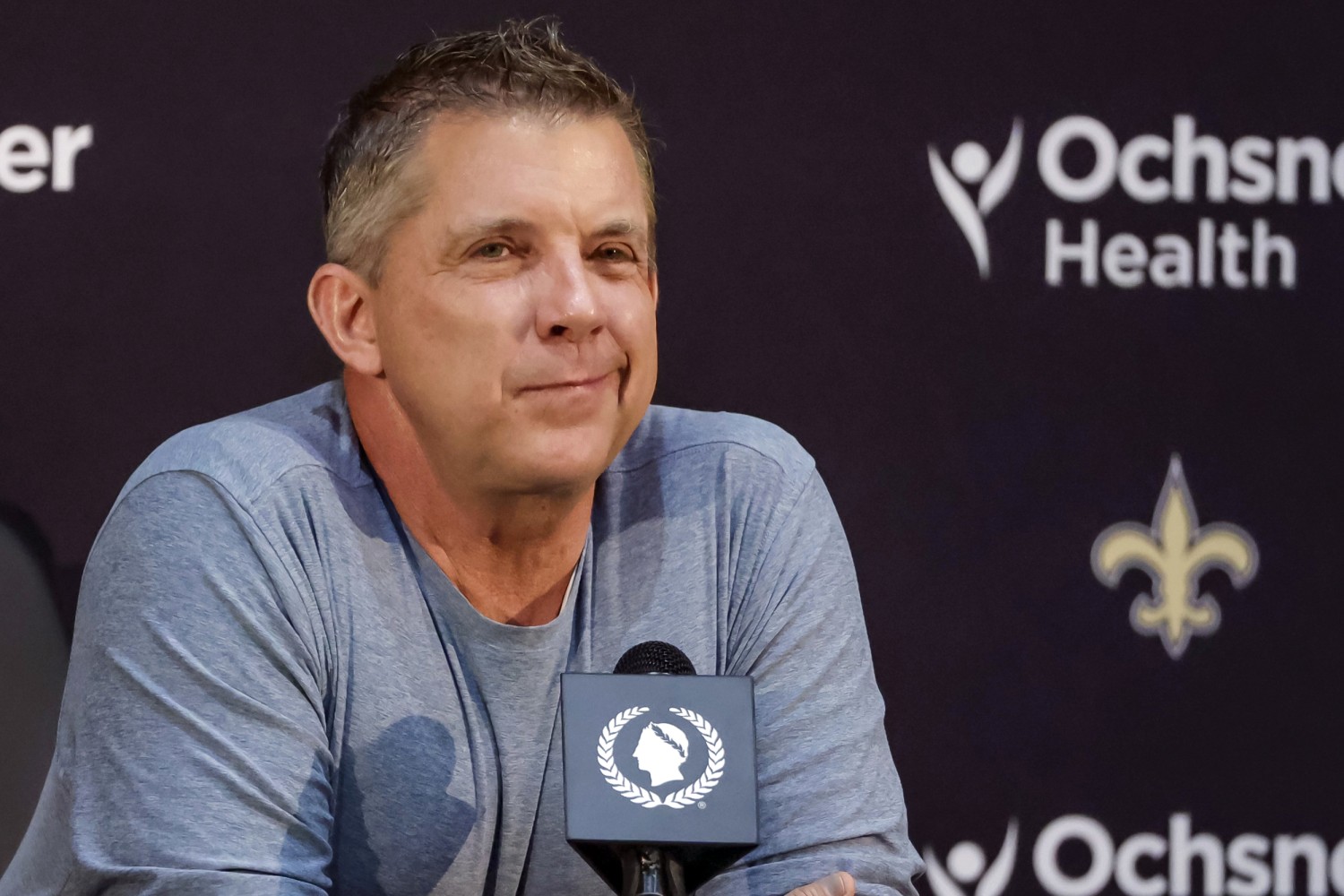 New Orleans Saints head coach Sean Payton (R) watches a replay on the  jumbotron at the Mercedes-Benz Superdome during play against the Baltimore  Ravens in New Orleans September 1, 2016. Photo by