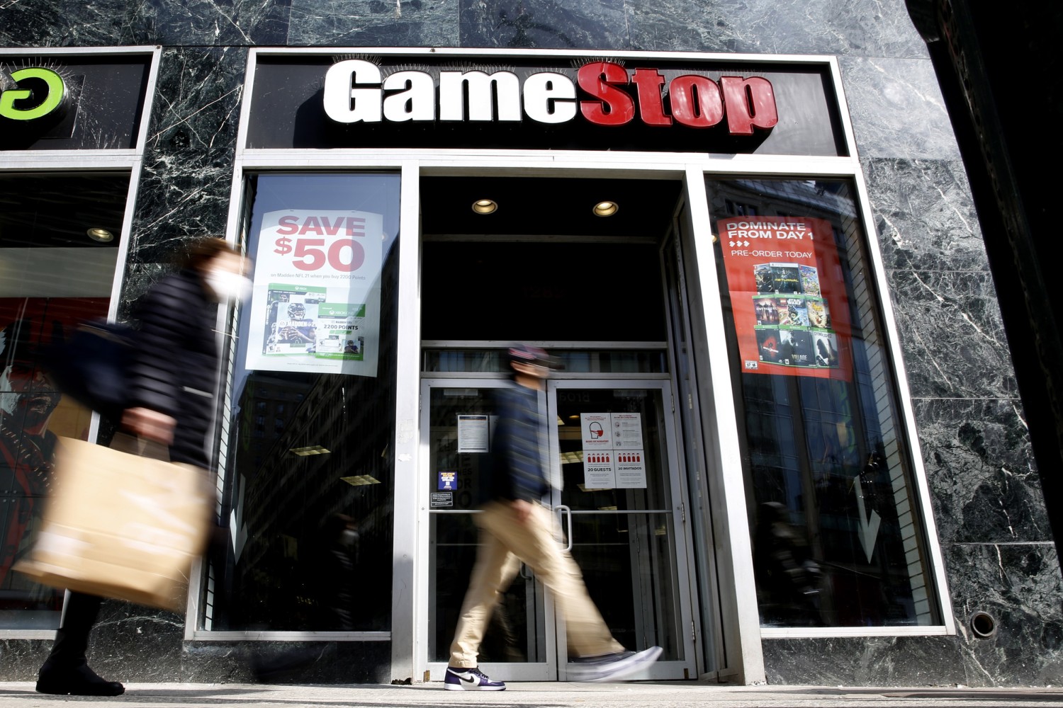 GameStop shares jump sharply in odd trading; AMC shares also pop