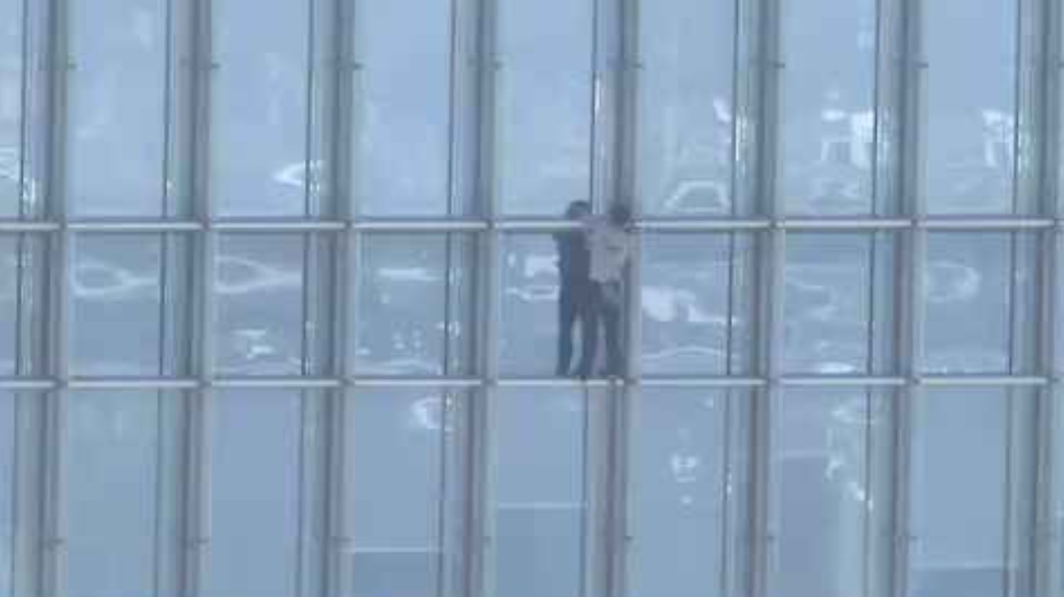 man climbing building in san francisco