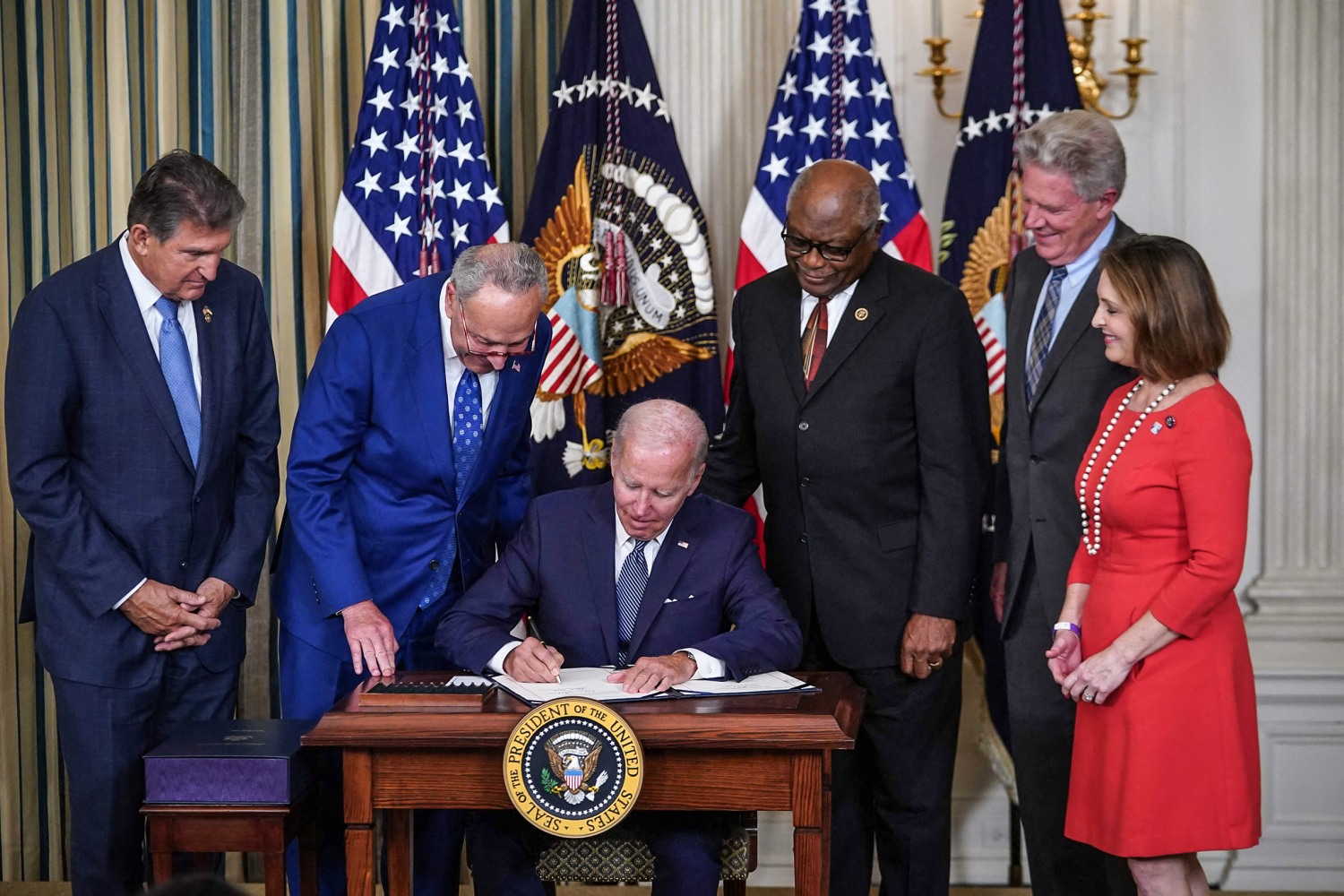 President Joe Biden signs major climate health care and tax bill