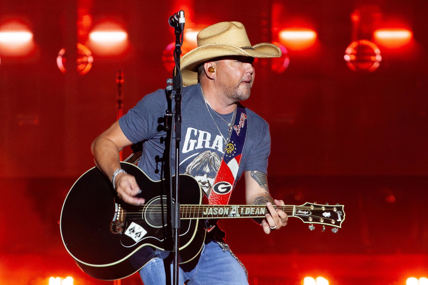 Jason Aldean performing live on stage with his band