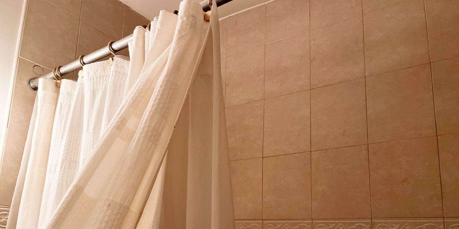 washing-a-shower-curtain