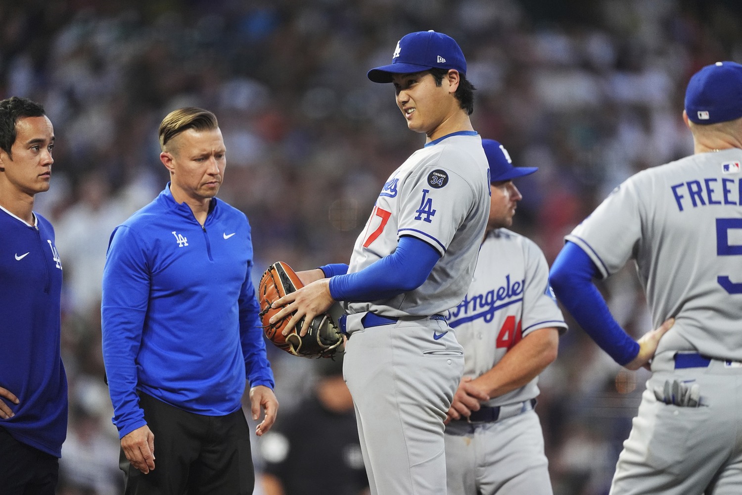 Dodgers' Ohtani roughed up by Rockies, leaves game after getting