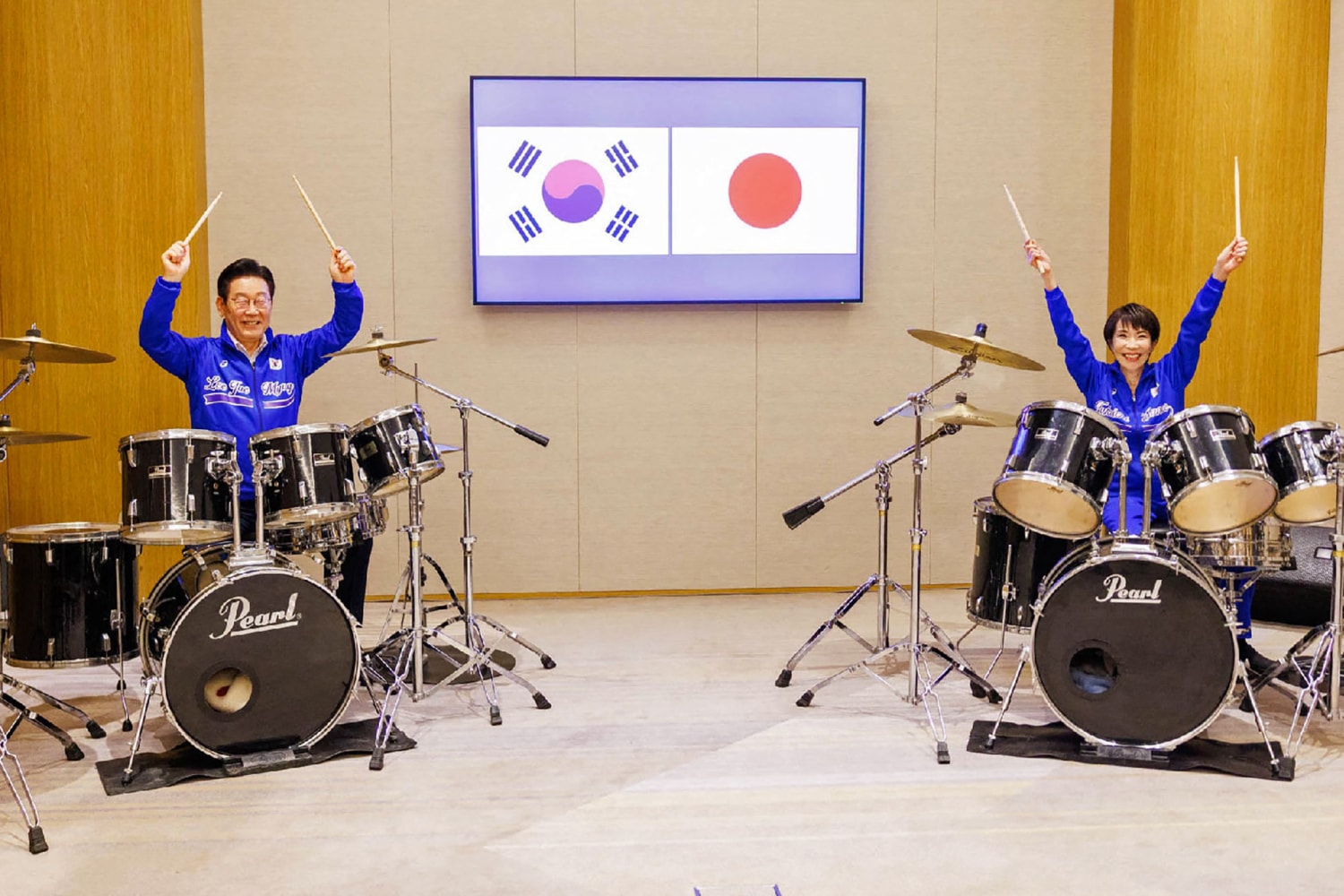 Japanese and South Korean leaders jam to K-pop hits at a summit