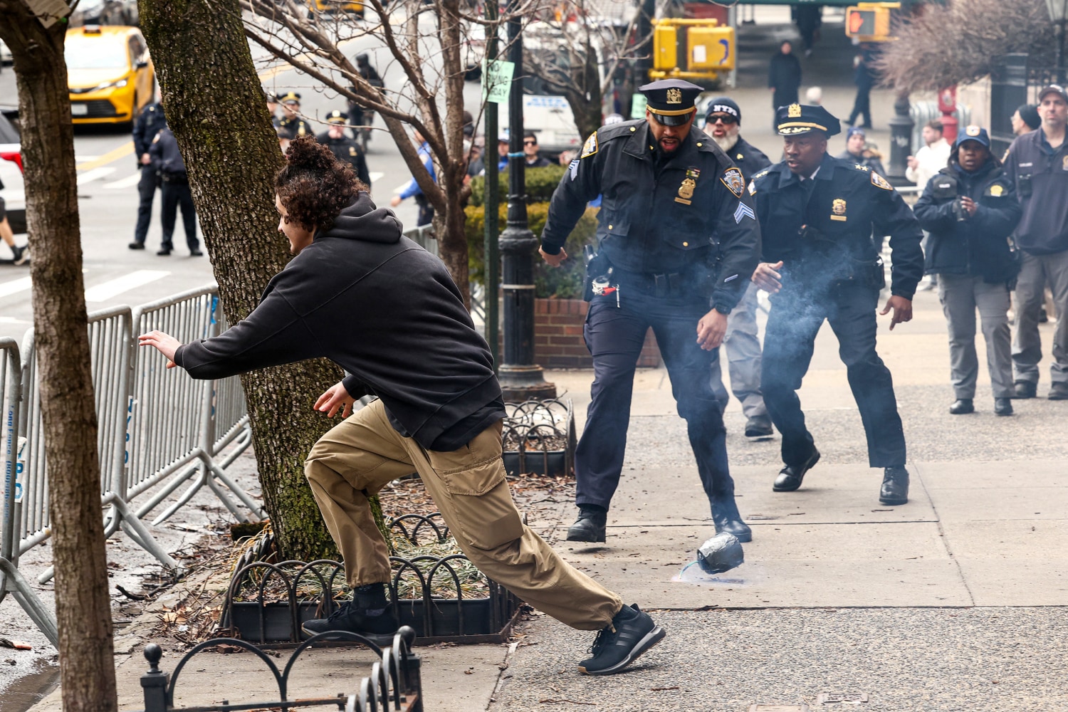 Scene outside Gracie Mansion in New York City during the March 7 2026 protest where two suspects threw homemade explosive devices at a crowd of demonstrators