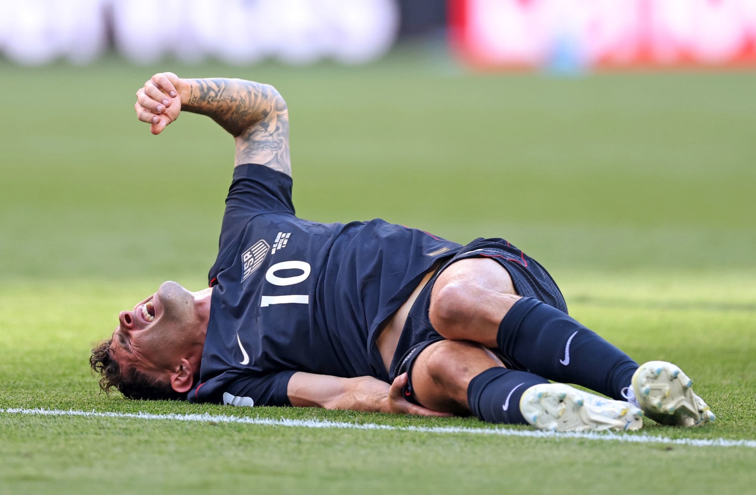Christian Pulisic looks dejected on the field