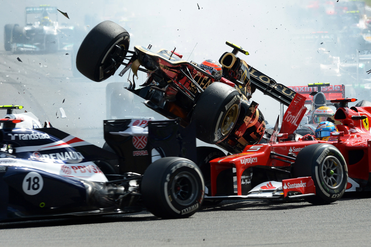 Grosjean of Lotus, Alonso of Ferrari crash in Belgian Grand Prix