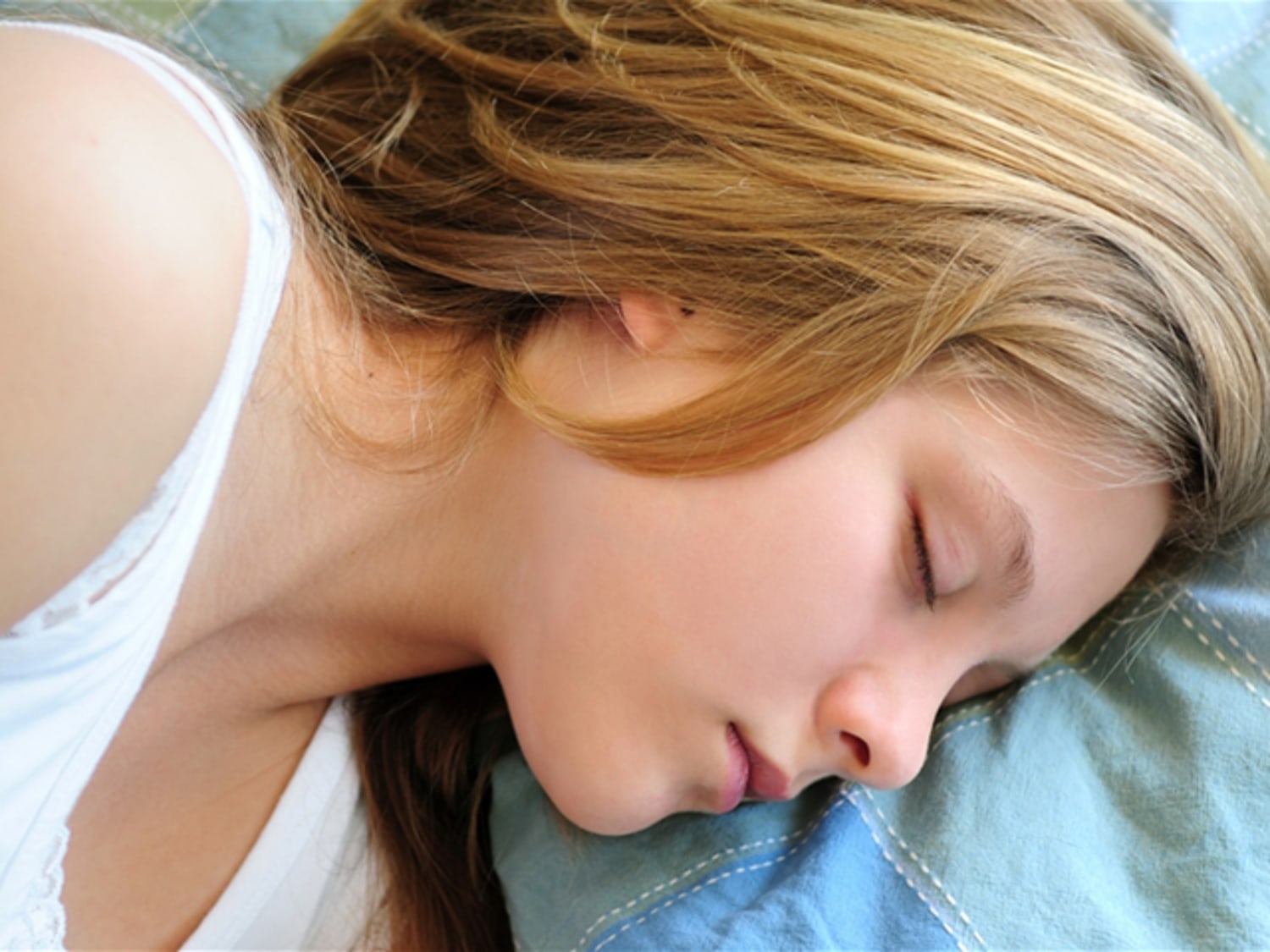 Sleeping beauty. Top view of beautiful young brown hair woman in