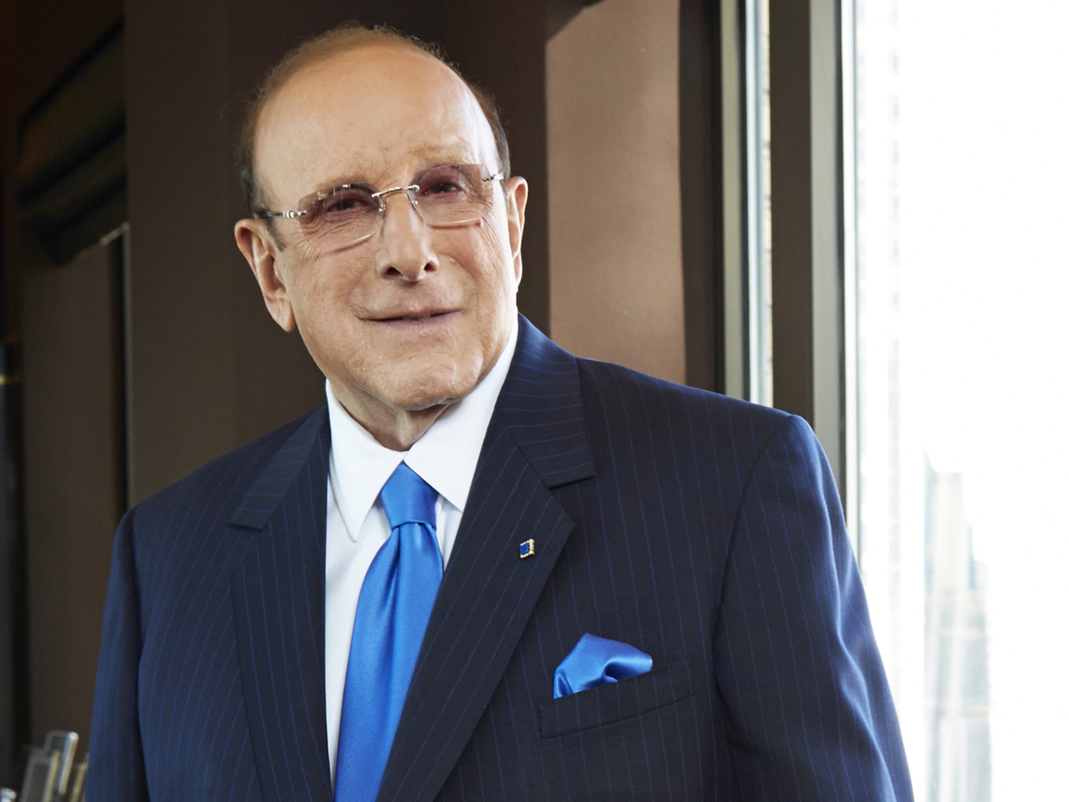 How long has clive davis been in a relationship?