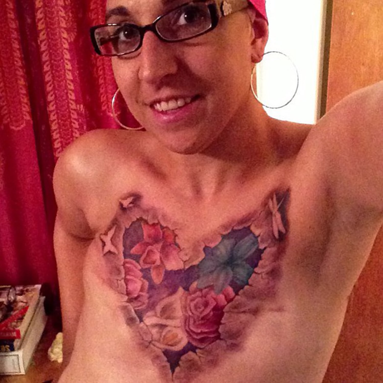 Flat and fabulous Topless tattoo selfie inspires cancer survivors image