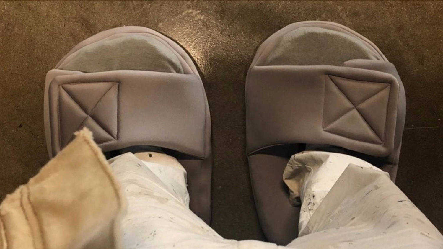 Kanye West dons huge shoes after social media ridicule