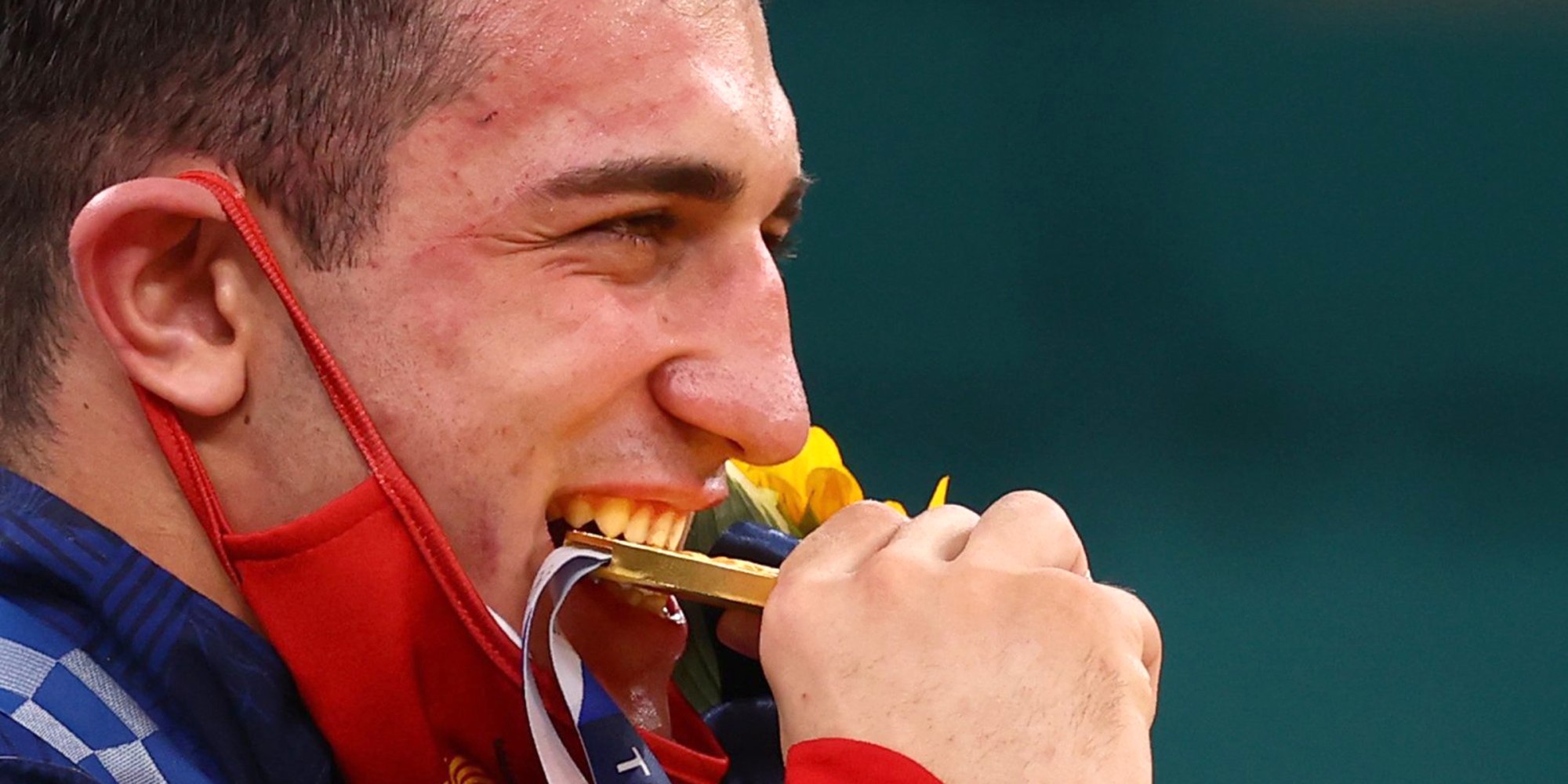 You've just won a gold medal! So why are you trying to eat it?