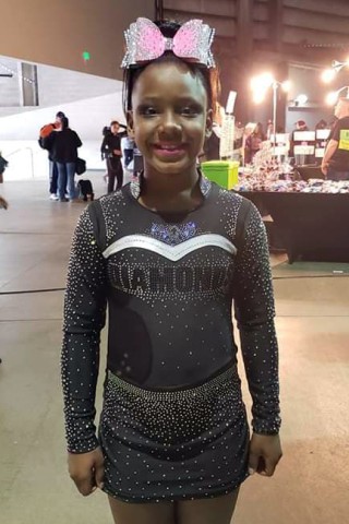 Black cheerleader kicked off team over her natural hair mom says