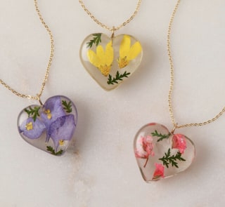 Tulianna and Alejandra Garces Birth Month Flower Heart Necklace