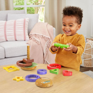 Child playing with LeapFrog 4-in-1 Learning Hamburger.
