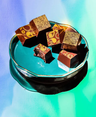 Compartes boozy chocolates arranged on a small dish.