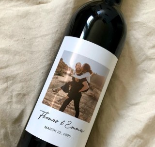 Wine bottle with couple picture of label and their names