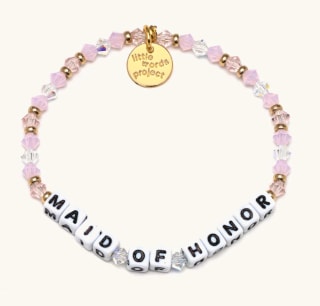 pink beaded bracelet on white background