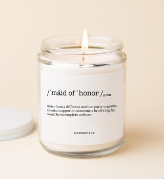 Maid of Honor candle lit on cream background