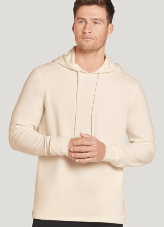 Man wearing cream colored Jockey lightweight fleece hoodie.