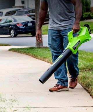 Man holding Greenworks leaf blower