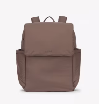 a photo of a dark brown diaper bag from Calpak