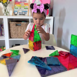 Child playing with Magna-Tiles.