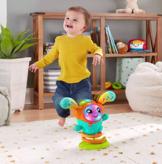 Child dancing and playing with Fisher-Price DJ Bouncin' Beats.