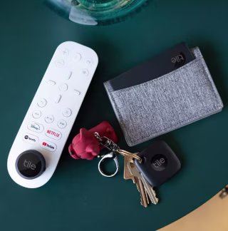 Tile Mate Essentials on a remote, set of keys and wallet.
