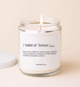 Maid of Honor candle lit on cream background