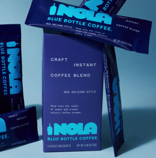 Blue Bottle NOLA single serving sachets arranged around box.