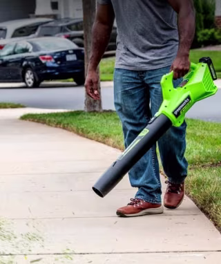 Man holding Greenworks leaf blower