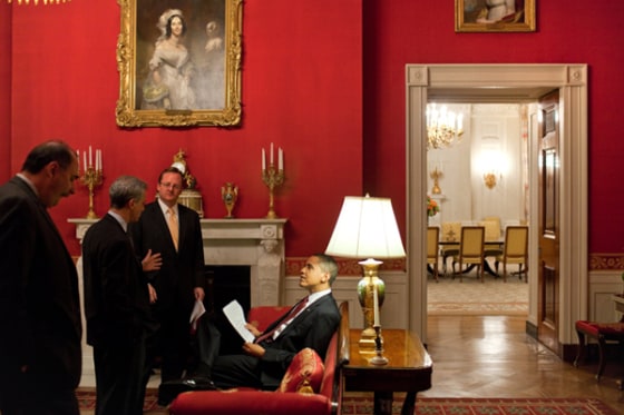 President Barack Obama with Senior Advisor David Axelrod, then-Chief of Staff Rahm Emanuel and Press Secretary Robert Gibbs in the Red Room of the White House prior to a press conference in March 2009. By February, all three staffers will have left the White House.