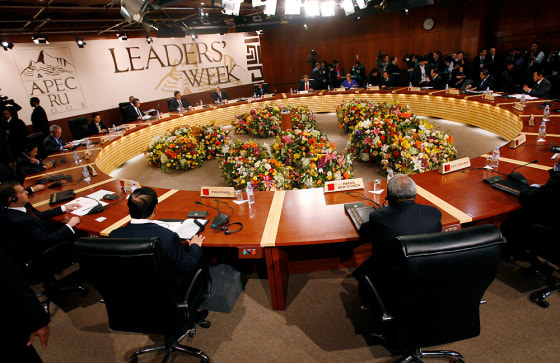 Image: Leaders take their seats at the start of the first meeting of the Asia-Pacific Economic Cooperation (APEC) summit in Lima