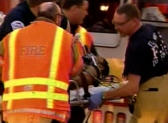 Paramedics load a victim into an ambulance outside the Southcenter Mall in Tukwila, Wash., on Saturday.