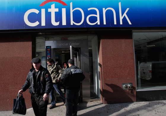 Image: People walk out of a Citibank branch