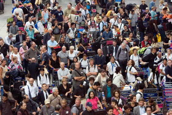 Image: Stranded Western tourists wait for transportation Wednesday, Nov. 26, 2008, at Bangkok, Thailand's Suvarnabhumi airport following a takeover of the facility by the People's Alliance for Democracy