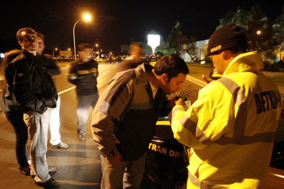 Image: A driver takes a breathalyzer test in Brasilia, Brazil