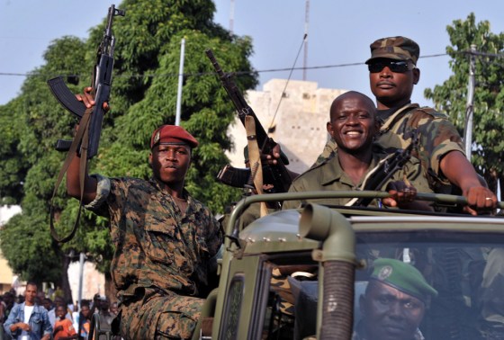 Pro-coup soldiers parade through the streets of Conakry, Guinea's capital, Dec. 24, 2008.