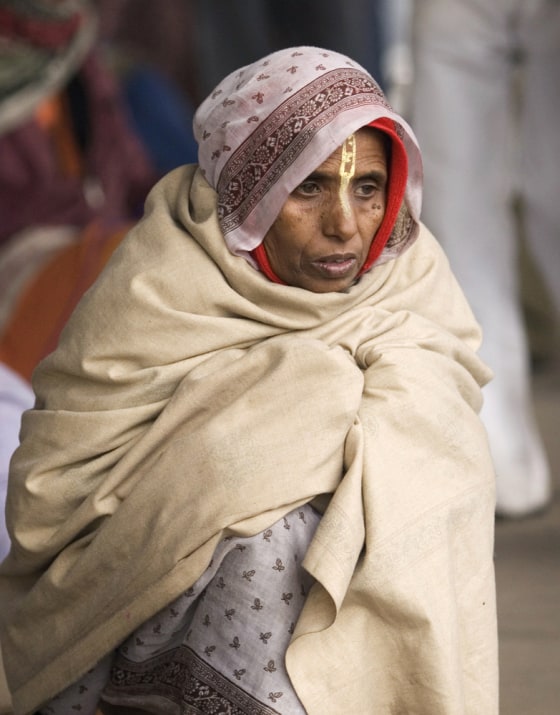 Image: woman shivers in cold