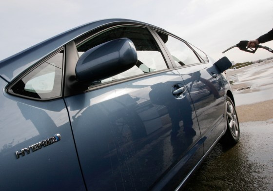 Image: A Toyota Prius stops at a gas pump